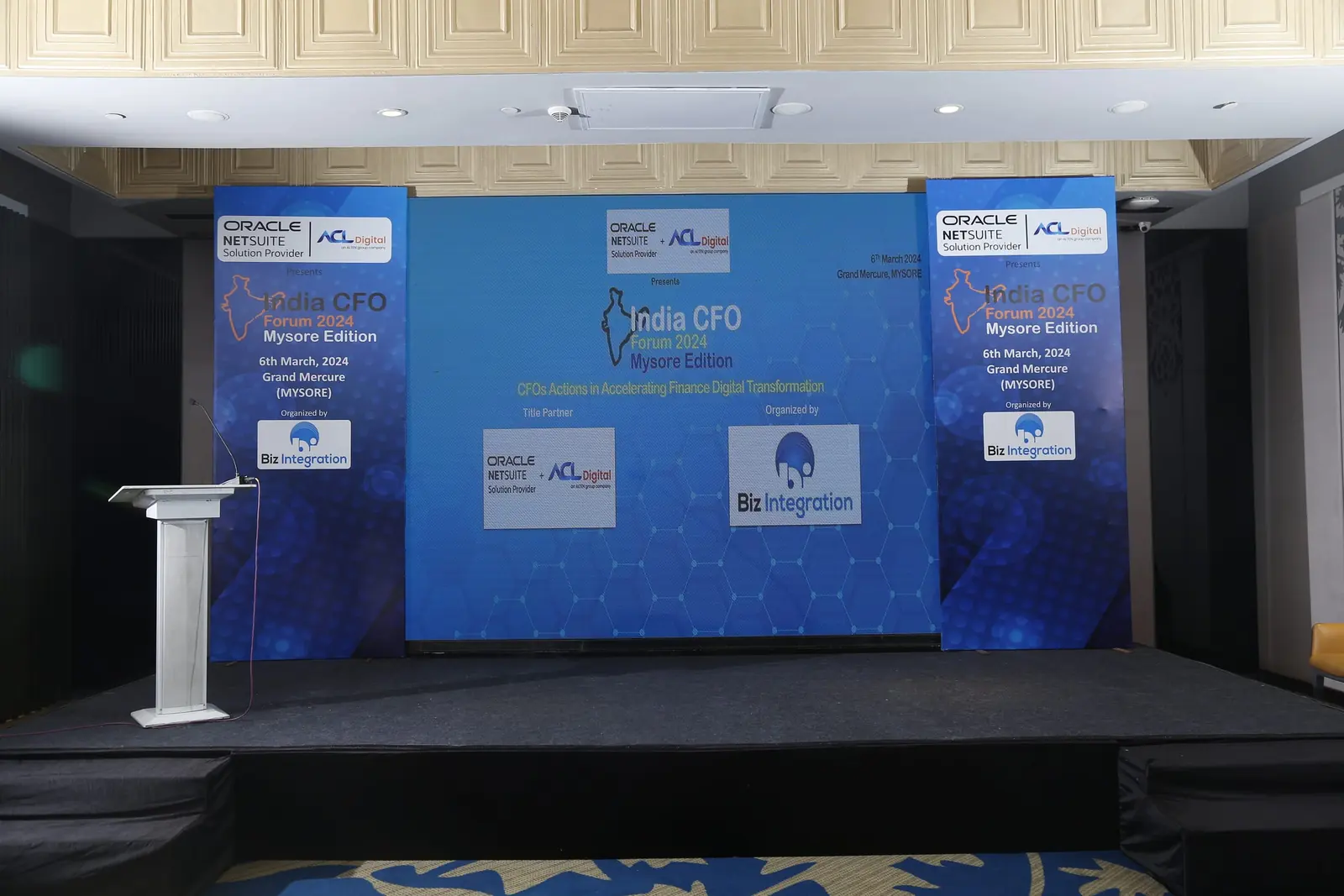 Corporate conclave stage with a large LED backdrop and podium